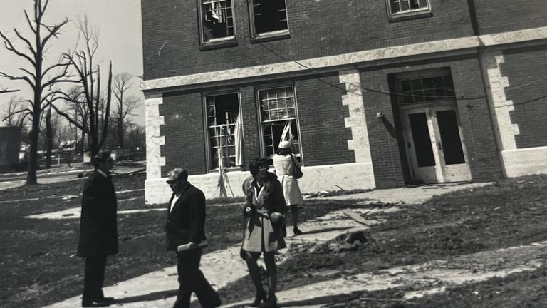 survivors of the 1974 tornado outside of a building on the central state university campus