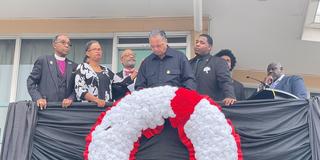 seven people, including Cameron Barnes, participate in the Lorraine Motel Wreath Laying Service in April 2022