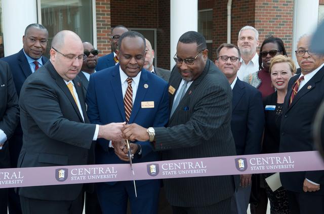 Central State University President Dr. Jack Thomas, Dr. Schlag of the Honors College and other participants cut the ribbon for the new Honors College at Central State University