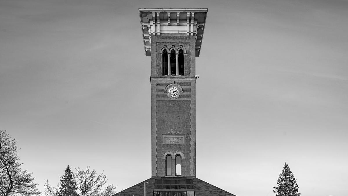 Central State University's historic clock tower is pictured before a pink sunset.