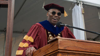 President Kuti speaks at the lecturn