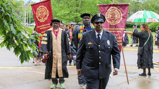 graduates walk in procession