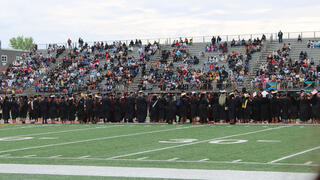 students walk in procession