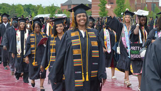 graduates walk in procession