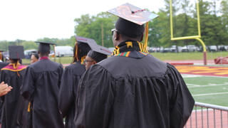 students walk in procession