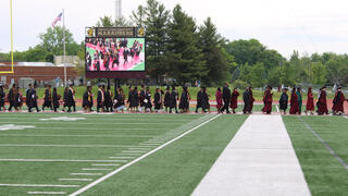 graduates walk in procession