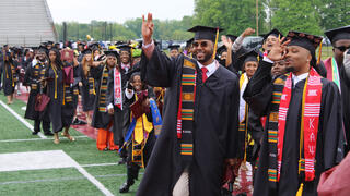 graduates walk in procession