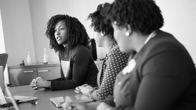 A black and white photo of Black entrepreneurs in a strategy session