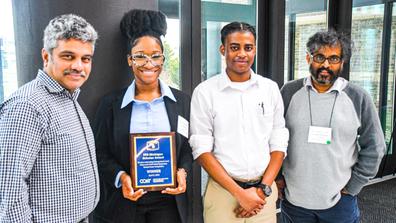 Marauders display an award from the CCAT Global Symposium for their project on self-driving cars