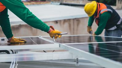 Workers use emerging technologies in manufacturing