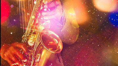Hands playing a saxophone with a colorful overlay of orange, red, and blue with sparkles