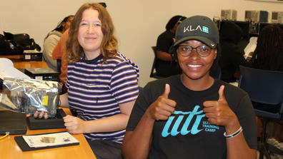 Two Central State University Intel summer interns with one holding two thumbs up