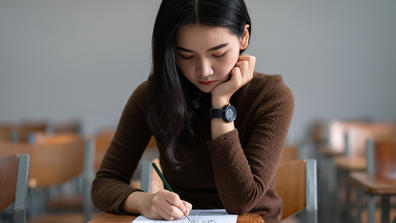 a student takes a test during final exams week