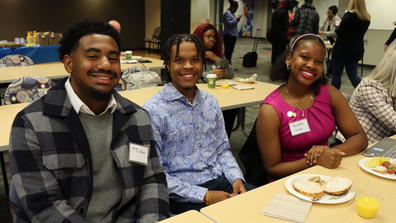 three central state university students at a meal with Marauder Land Media Group