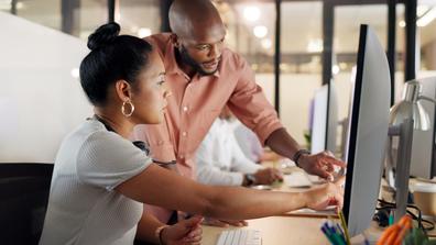 Collaboration, human resources and training with a business black woman talking to her manager or supervisor at work. Teamwork, meeting and management with a man and female employee in the office