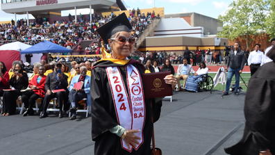 arline flournoy at age 82 wearing regalia on her 2024 graduation day at the football stadium at central state university