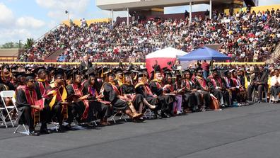 central state university class of 2024 on the football field with a packed stadium