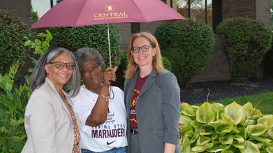 three staff members at university institute