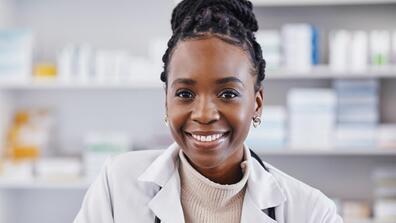 Black woman, doctor and portrait smile in healthcare, pharmacy or medication consultant at clinic. Face of happy African American female medical professional or pharmacist