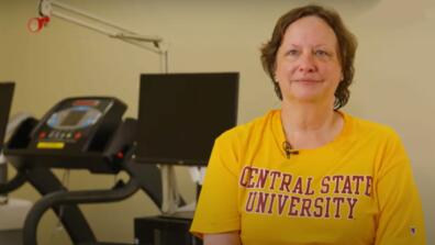 kathleen carter wearing a gold and maroon central state university shirt