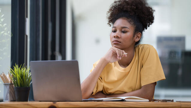 A student studies on her laptop computer