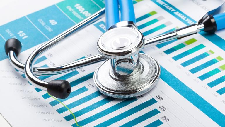 a closeup of a stethoscope and medical chart in a clinic