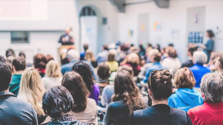 a large group of people attend a University-sponsored event