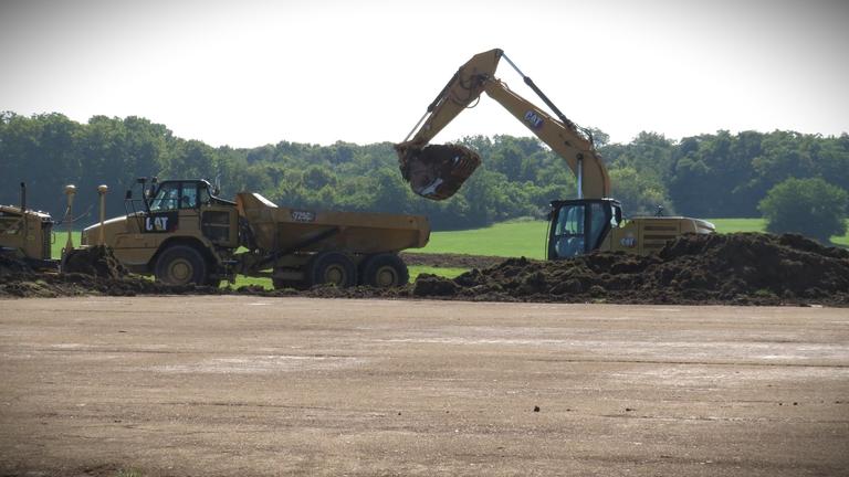 Tractors move dirt at the research facility site on State Route 42 in Wilberforce