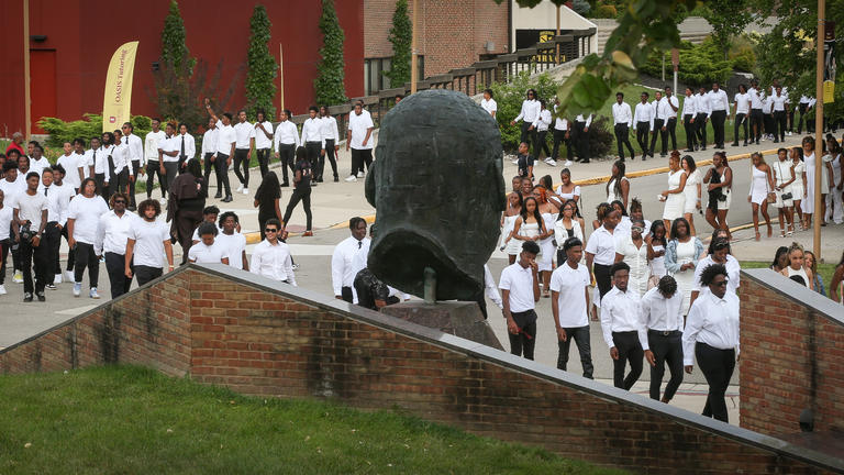 new first-year students participate in the candlelight ceremony at Central State University