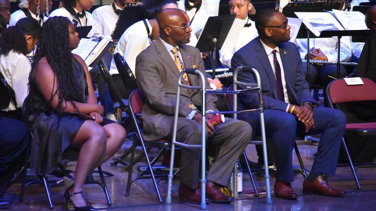 platform guests and central state university administrators on stage at the 2024 baccalaureate ceremony