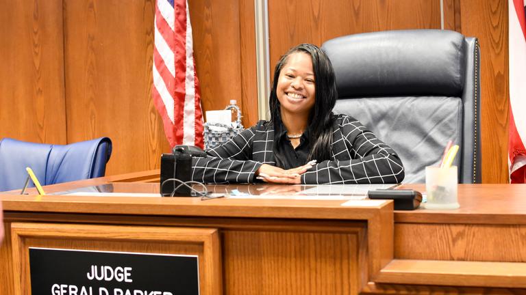 a young african american central state university student in the judge's seat