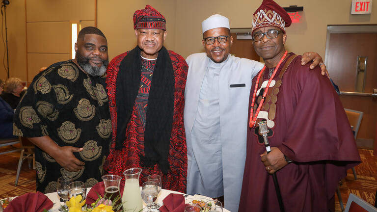 four people in traditional nigerian attire