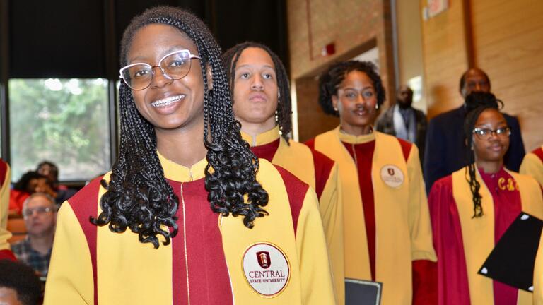 four central state university chorus members in formal robes