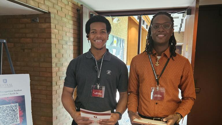 two volunteer ushers at the 2025 academic recognition convocation
