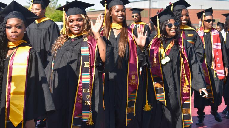 members of the central state university class of 2025 process into the football stadium