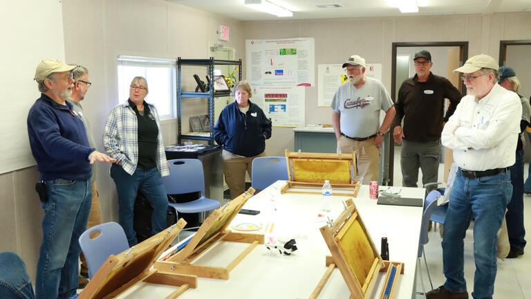 local beekeepers in the bee lab at central state