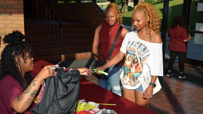 a member of the admissions team at central state university registers new students at new student orientation advising and registration