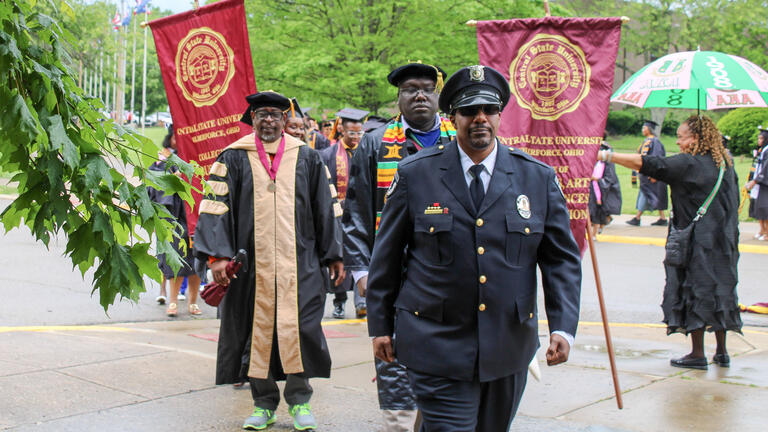 graduates walk in procession