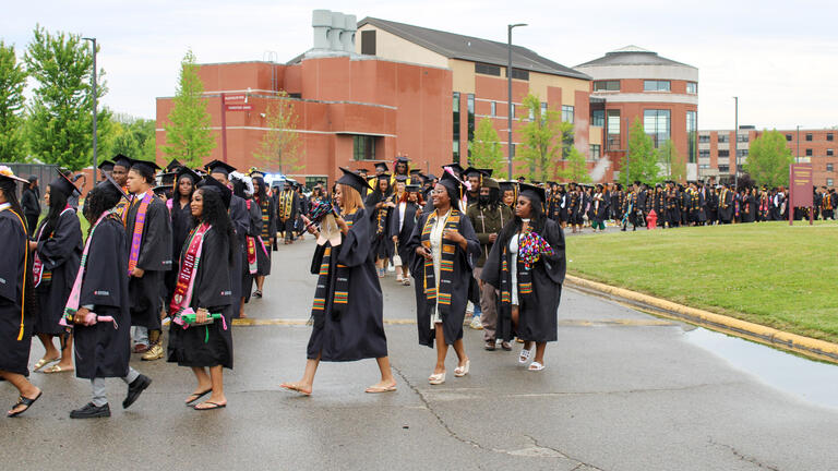graduates walk in procession