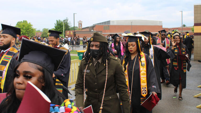 graduates walk in procession