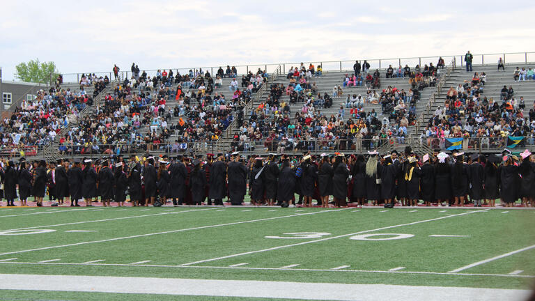 students walk in procession