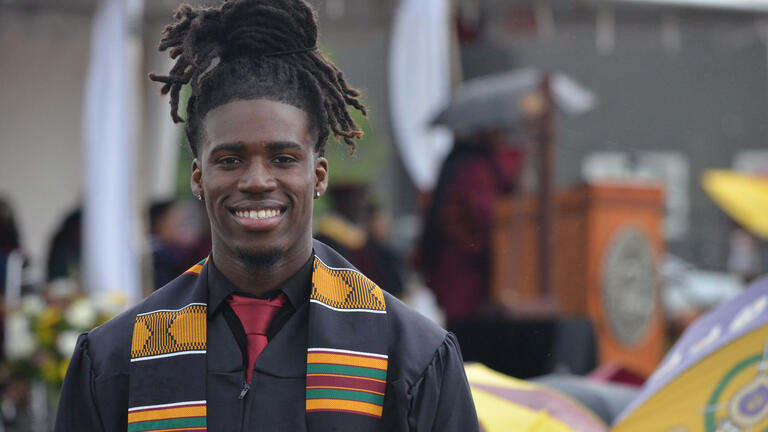 a graduate smiles