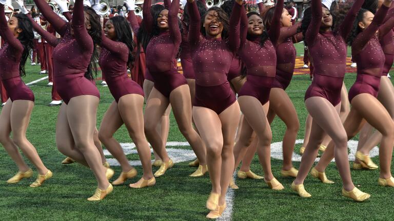 CSU Dancing Belles on the field dancing