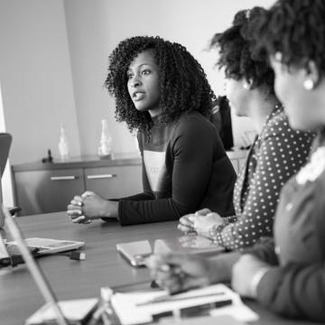 A black and white photo of Black entrepreneurs in a strategy session