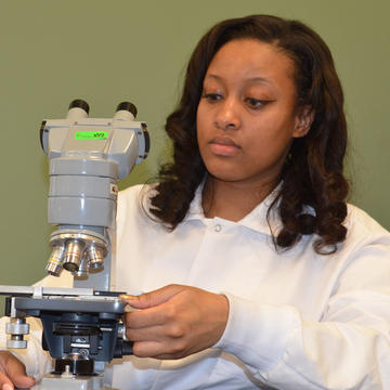 STEM student at the microscope