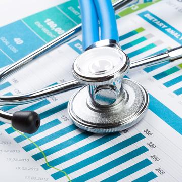 a closeup of a stethoscope and medical chart in a clinic