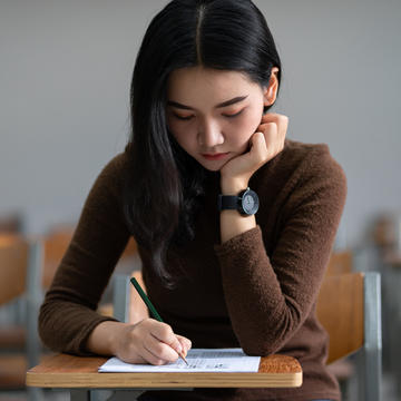 a student takes a test during final exams week