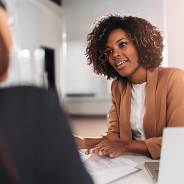 a young African American person interviews for a job