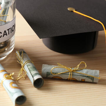 jar of money with graduation cap