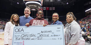 Ohio Education Association’s Assistant Executive Director Airica Clay, Ohio Education Association Vice President Jeff Wensing, Christian “Chrissy” Jackson, Central State University College of Education Interim Dean Lillian Drakeford, and Chrissy's mother, Shonda Peavy. The group is holding a large check made out to Chrissy totaling $5,000 for the top Aspiring Educator Scholarship. The scholarships were presented in Columbus on April 22.
